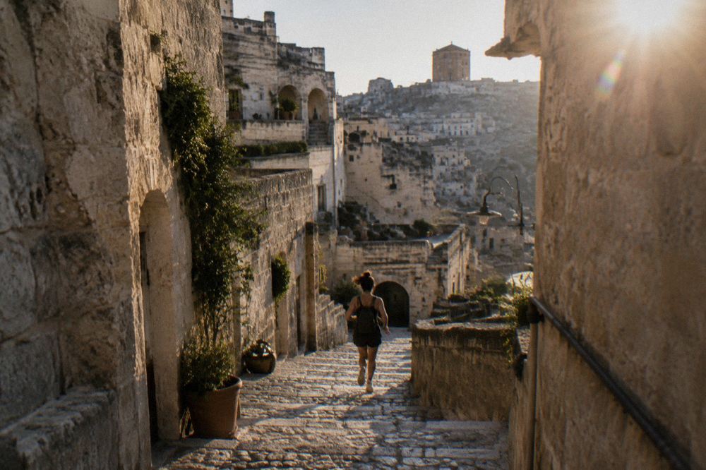 Narrow stepped lane between stone and cave houses in Sasso Barisano