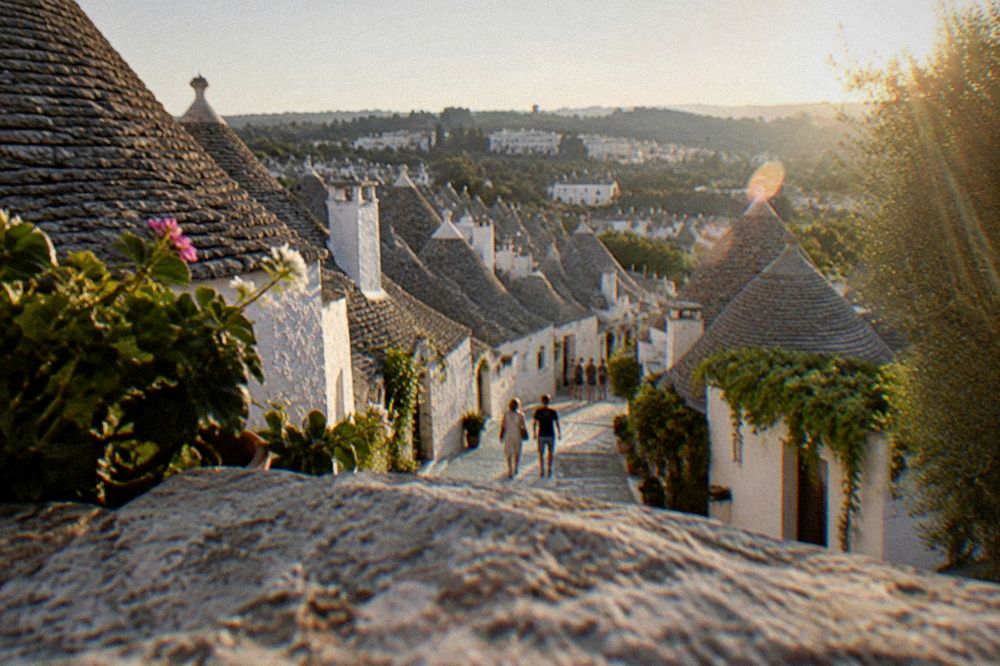 The trulli cone-roofed houses of Alberobello seen from a terrace above the town
