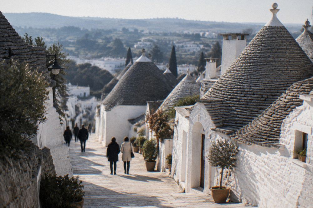 Whitewashed trulli houses with conical stone roofs in Alberobello